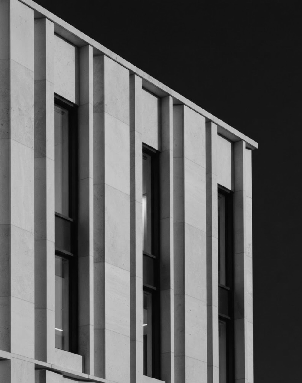 Monochrome architectural facade representing FSVMH private member privileges and discreet spaces